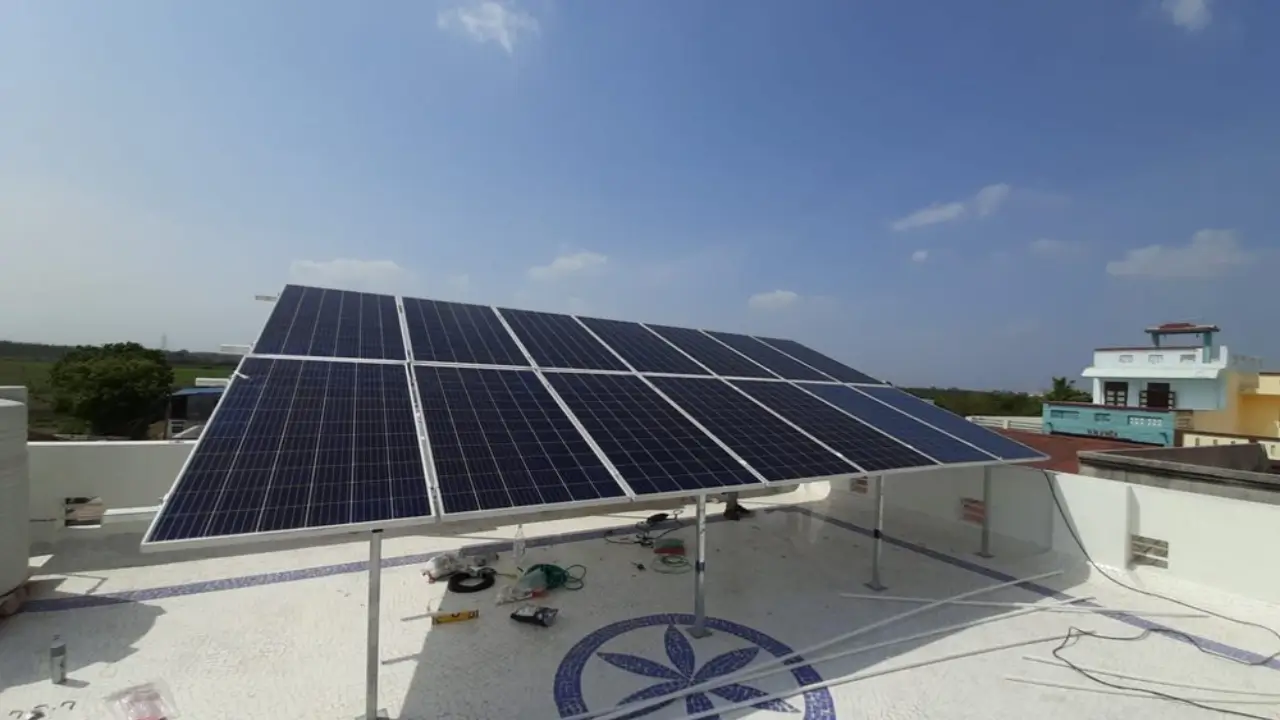 Residential rooftop solar panel installation on a flat-roof home